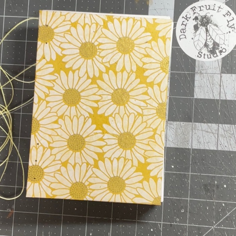 White and gold daisies on yellow paper. Hand Sewn Notebook Made in Alaska
